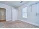A room with carpet, a closet, and a bright window at 205 W Emma St, Tampa, FL 33603