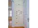 Hallway featuring white cabinets, hardwood floors, white door, black hardware and natural light from nearby windows at 205 W Emma St, Tampa, FL 33603