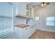 Kitchen with white cabinets, butcher block counters, farm sink and stainless faucet at 205 W Emma St, Tampa, FL 33603