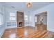 Spacious living area enhanced by hardwood floors, a cozy brick fireplace, and an open layout for modern living at 205 W Emma St, Tampa, FL 33603