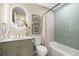 This bathroom features a modern vanity with a backlit mirror and attractive tile in the shower/tub area at 2066 62Nd Pl S 62Nd Pl, St Petersburg, FL 33712