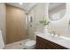 Modern bathroom featuring wood vanity, vessel sink, and a glass shower with pebble floor at 2066 62Nd Pl S 62Nd Pl, St Petersburg, FL 33712