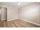 A bedroom with light walls, new flooring, a ceiling fan, and a view to an adjoining hallway at 2066 62Nd Pl S 62Nd Pl, St Petersburg, FL 33712