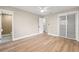 Light filled bedroom with light wood floors, closet, and attached bathroom at 2066 62Nd Pl S 62Nd Pl, St Petersburg, FL 33712