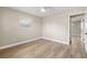 This bedroom features light wood flooring, neutral walls, and a ceiling fan at 2066 62Nd Pl S 62Nd Pl, St Petersburg, FL 33712