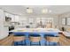 Bright kitchen with a large island, white cabinets, stainless steel appliances, and pendant lighting at 2066 62Nd Pl S 62Nd Pl, St Petersburg, FL 33712