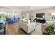 Bright living room with modern furnishings, wood beam and an open layout flowing into the kitchen at 2066 62Nd Pl S 62Nd Pl, St Petersburg, FL 33712
