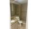 Tiled bathroom featuring a granite-topped vanity and a walk-in shower at 2160 Corbin Pl # C, Palm Harbor, FL 34683