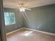 Cozy bedroom with tiled flooring and a bright window, providing ample natural light at 2160 Corbin Pl # C, Palm Harbor, FL 34683
