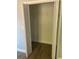 Empty closet featuring wood flooring and bifold doors at 2160 Corbin Pl # C, Palm Harbor, FL 34683