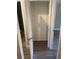 Empty closet space featuring laminate flooring and an adjustable shelving system at 2160 Corbin Pl # C, Palm Harbor, FL 34683
