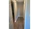 Hallway featuring wood flooring and neutral wall color at 2160 Corbin Pl # C, Palm Harbor, FL 34683