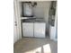 Laundry room with white washer and dryer units, and utility sink and mechanicals at 2160 Corbin Pl # C, Palm Harbor, FL 34683