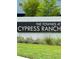 Sign for The Townes at Cypress Ranch with plants in front at 2190 Great Sapphire Ln, Lutz, FL 33558