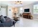 Inviting living room with tile flooring, neutral walls, and cozy sofa at 2190 Great Sapphire Ln, Lutz, FL 33558