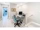 This office space includes a desk and chair and features light wood floors and neutral wall color at 2190 Great Sapphire Ln, Lutz, FL 33558