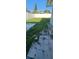 View of the backyard with partial lawn and paver patio next to white fencing at 2469 Trade Winds Dr, Dunedin, FL 34698