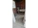 Unfinished basement area with hot water heater and utility sink, ready for renovation and customization at 2469 Trade Winds Dr, Dunedin, FL 34698