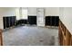 Spacious living room with original floors, awaiting renovation and personalization to your taste at 2469 Trade Winds Dr, Dunedin, FL 34698