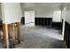 Bright living room awaiting renovation, featuring studs and original flooring, a canvas for your design at 2469 Trade Winds Dr, Dunedin, FL 34698