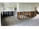 View of a living room with studs and missing drywall, awaiting renovation and your creative ideas at 2469 Trade Winds Dr, Dunedin, FL 34698