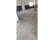 Open living room with subflooring, windows, and exposed framing ready for renovation at 2469 Trade Winds Dr, Dunedin, FL 34698