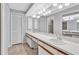 Bathroom featuring a double sink vanity, neutral walls, and ample storage at 2640 Enterprise E Rd # B25, Clearwater, FL 33759