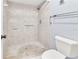 Neutral-colored bathroom featuring a tile-walled shower and tile floor at 2640 Enterprise E Rd # B25, Clearwater, FL 33759