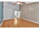 Bedroom featuring a ceiling fan, neutral-colored walls, and wood-look floors at 2640 Enterprise E Rd # B25, Clearwater, FL 33759