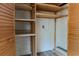 Open closet featuring wooden shelves at 2640 Enterprise E Rd # B25, Clearwater, FL 33759