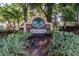 Community entrance sign reading 'Europa', surrounded by lush landscaping, decorative mulch, and palm trees at 2640 Enterprise E Rd # B25, Clearwater, FL 33759