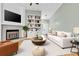 Bright, inviting living room with a fireplace and built-in shelving, perfect for relaxation and entertainment at 2640 Enterprise E Rd # B25, Clearwater, FL 33759