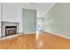 Open living room with hardwood floors and a modern fireplace at 2640 Enterprise E Rd # B25, Clearwater, FL 33759