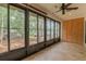 Well-lit sunroom with large windows and view of the trees at 2640 Enterprise E Rd # B25, Clearwater, FL 33759
