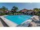 Outdoor swimming pool with clear blue water, surrounded by lounge chairs and landscaping in a community setting at 2640 Enterprise E Rd # B25, Clearwater, FL 33759