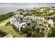 Stunning aerial view of the community with pool, parking, and views of the bay at 2900 Cove Cay Dr # 7C, Clearwater, FL 33760