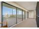 Spacious screened balcony featuring sliding glass doors and a lovely view at 2900 Cove Cay Dr # 7C, Clearwater, FL 33760