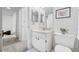 Bathroom featuring a vanity, mirror, and toilet, optimizing space and convenience in a compact design at 2900 Cove Cay Dr # 7C, Clearwater, FL 33760