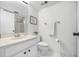Bathroom with white fixtures, a framed mirror, and clean lines that reflect modern simplicity and functionality at 2900 Cove Cay Dr # 7C, Clearwater, FL 33760