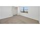Bedroom with ample natural light, neutral carpet and closet space providing a serene and comfortable retreat at 2900 Cove Cay Dr # 7C, Clearwater, FL 33760