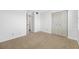 This is a bedroom with carpet, closet space, and an ensuite bathroom, promoting convenience and privacy at 2900 Cove Cay Dr # 7C, Clearwater, FL 33760