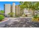 Beautiful condo building with covered parking, manicured landscaping, and inviting entrance at 2900 Cove Cay Dr # 7C, Clearwater, FL 33760