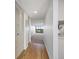 Bright hallway with hardwood floors leading to a living area with a view at 2900 Cove Cay Dr # 7C, Clearwater, FL 33760