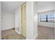 Hallway leading to a bedroom with natural light, a neutral color scheme that enhances the serene atmosphere at 2900 Cove Cay Dr # 7C, Clearwater, FL 33760