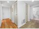 Inviting hallway with wood floors, closet storage and access to other rooms that suggests comfortable living at 2900 Cove Cay Dr # 7C, Clearwater, FL 33760