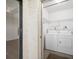 Convenient laundry room featuring a washer, dryer, and wire shelving at 2900 Cove Cay Dr # 7C, Clearwater, FL 33760
