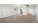 A bright living room leads into a kitchen and entryway at 2900 Cove Cay Dr # 7C, Clearwater, FL 33760