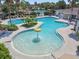 Community pool with a splash fountain offering recreation for all ages at 32015 Summerglade Dr, Wesley Chapel, FL 33545