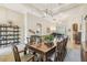 Spacious formal dining room with tile floors and large dining table at 32015 Summerglade Dr, Wesley Chapel, FL 33545