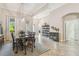 Formal dining room area boasts crown molding and view to formal living at 32015 Summerglade Dr, Wesley Chapel, FL 33545